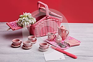 Picnic card with table setting and snowdrops, with blank note paper, silverware, pink and white checkered napkin