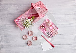 Picnic card with table setting and snowdrops, with blank note paper, silverware, pink and white checkered napkin