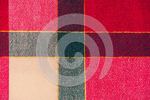 Picnic cloth. The checkered tablecloth on a table. Texture of white fabric in a red cell. Background image