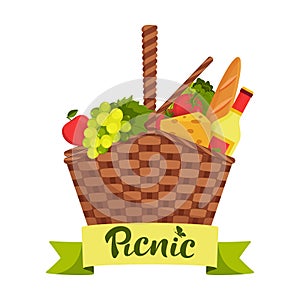 Picnic concept. Wicker picnic basket full of healthy food. Bottle of wine, apple, pear, cheese, baguette, grapes, tomato, salad.
