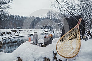 A picnic on a fishing trip, on a snow-covered winter river