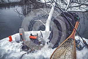 A picnic on a fishing trip, on a snow-covered winter river