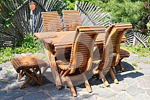 Picnic garden furniture: wooden table with chairs without people.summer outdoors