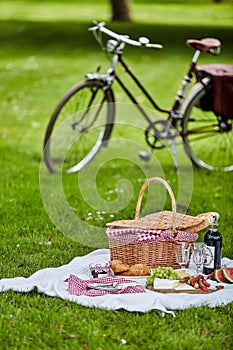 Picnic hamper and food with a bicycle