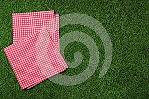 Picnic napkins on grass, top view