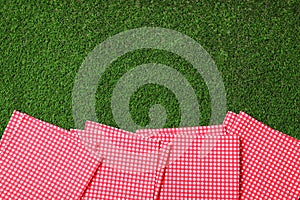 Picnic napkins on grass. Space for text