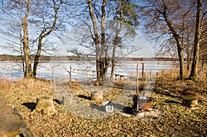 Picnic place on an island in Lake Usma on a sunny winter day