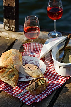 Picnic on the river with liver pate and wine