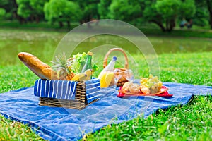 Picnic setting with white wine, pears, fruits,