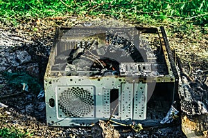 A picnic with a fire and a grill in the old computer case
