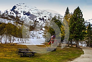 Picnic spot below a snow covered hill