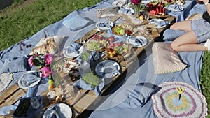 Picnic table on the beach, the photographer removes the table setting