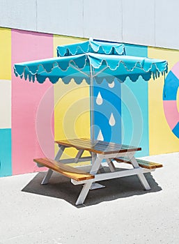 Picnic table with a blue umbrella