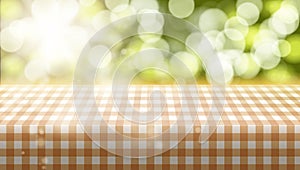 Picnic Table Covered With Tablecloth On Blurred Background