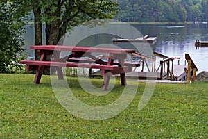 Picnic table in front of pond in the rain