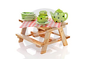 Picnic table with green dotted tablewear photo