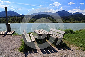 Picnic table next to river Drava in Austria