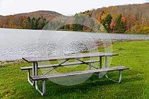 A picnic table overlooking the fall foliage near Mount Pisgah State Park, Troy, Pennsylvania, U.S