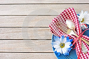 Picnic Table Setting in Red White and Blue Colors for July 4th Celebration on Wood Board Background Table with room or space for c