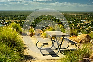 Picnic table on top of the Towers Hill lookout point overlooking Charters Towers, Queensland, Australia photo