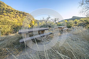 Picnic tables and benches along a hiking trail in Sabino Canyon Arizona