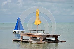 Picnic tables in water in Belize