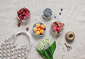 Picnic time. Handmade macrame bag on the linen background