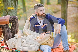 Picnic time. Happy loving couple relaxing in park together. Romantic picnic forest. Couple in love tourists relaxing on