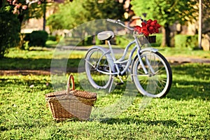 Picnic time. Nature cycling tour. Retro bicycle with picnic basket. Bike rental shops primarily serve typically