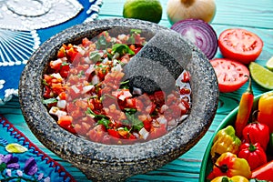 Pico de Gallo sauce from Mexico in molcajete photo