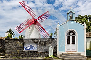 Pico Vermelho windmill on the coast of Sao Miguel Island photo