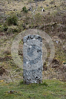 Pictish stone with distinct symbols carved on front face standing on the ground found in Isle of Raasay, Scotland, UK