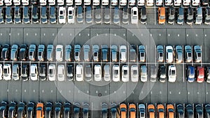 Pictorial automobiles rows located on storage parking lot