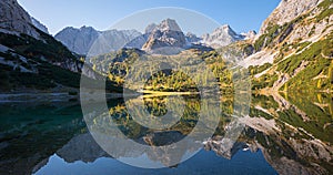 Pictorial autumn landscape, hiking trail to Seebensee mountain lake and view to famous Zugspitze