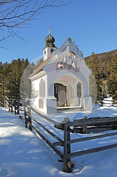 Pictorial chapel in wintry landscape