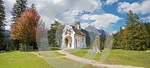 Pictorial pilgrimage chapel near lake lautersee, alpine landscape bavaria