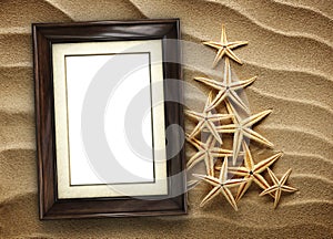 Picture frame on shells and sand background