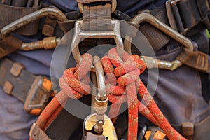 Picture of 10.5 MM dynamic rope low elongation fastening with barrel knot into safety industry fall body abseiling harness loop