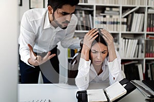 Picture of angry boss criticizing his worker