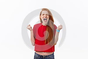 Picture of angry young woman standing over white background. Looking camera