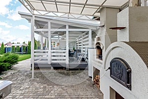 Picture of arbour with comfortable garden furniture