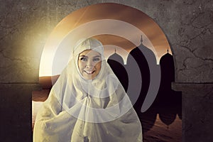 The picture of asian muslim woman pray to god with mosque backgr