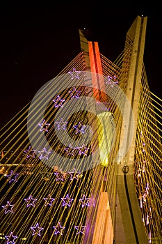Awesome bridge lit up at night photo