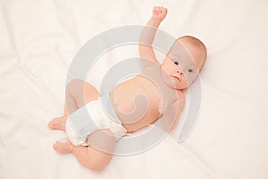 Picture of baby lying on bed