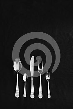 Beautiful silver cutlery on a black background