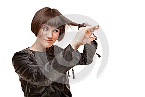 Picture of beautiful woman hairstylist doing herself haircut