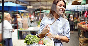 Picture of woman at marketplace buying fruits