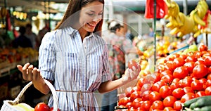 Picture of woman at marketplace buying fruits