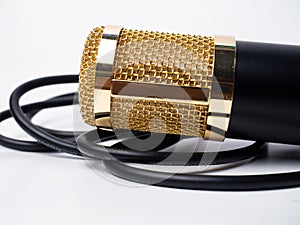 Picture of a black condenser microphone on a white isolated background