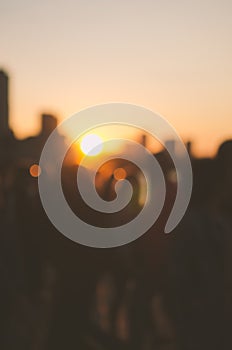 Picture blurred for background. People walking down the street in the evening.